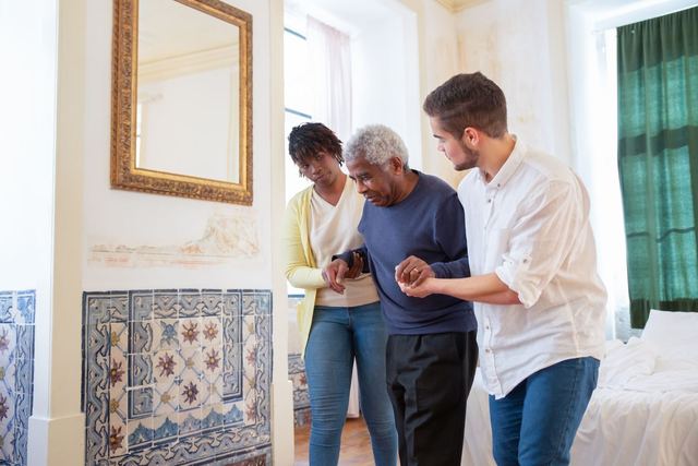Elderly man receiving assistance in a beautiful room with traditional Portuguese tiles.